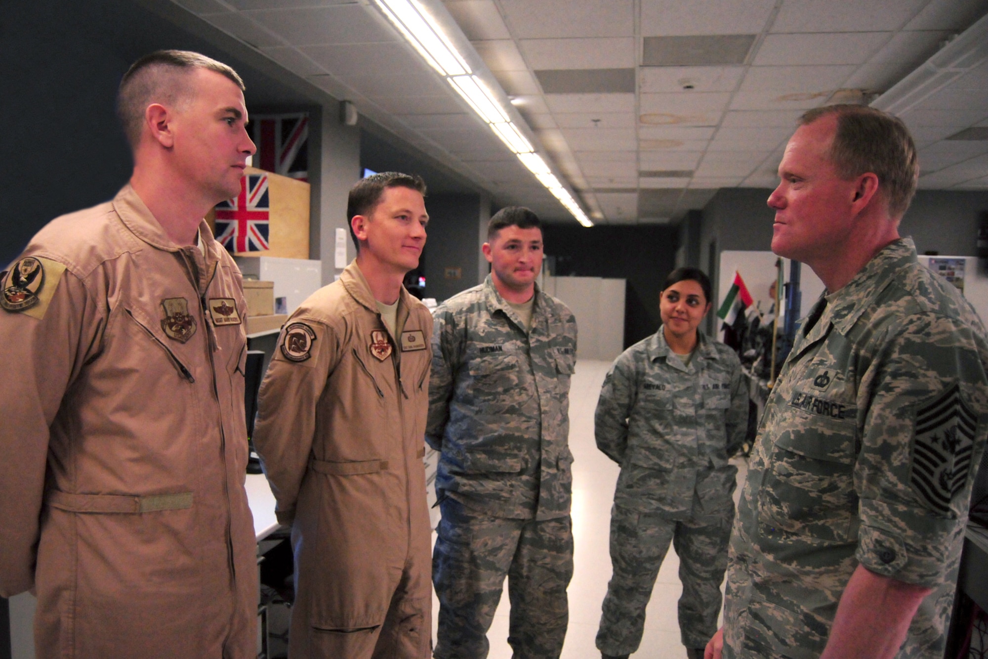 AL UDEID AIR BASE, Qatar – Chief Master Sgt. of the Air Force James Cody thanks a group of Airmen from the Combined Air and Space Operations Center at Al Udeid Air Base, Qatar, for their support of forward-deployed service members throughout the Southwest Asia area of operation April 17, 2014. Cody spent the day visiting Airmen and thanking them for their dedication, reminding them they are the Air Force’s most valuable resource. (U.S. Air Force photo illustration/Staff Sgt. J. Aaron Breeden)