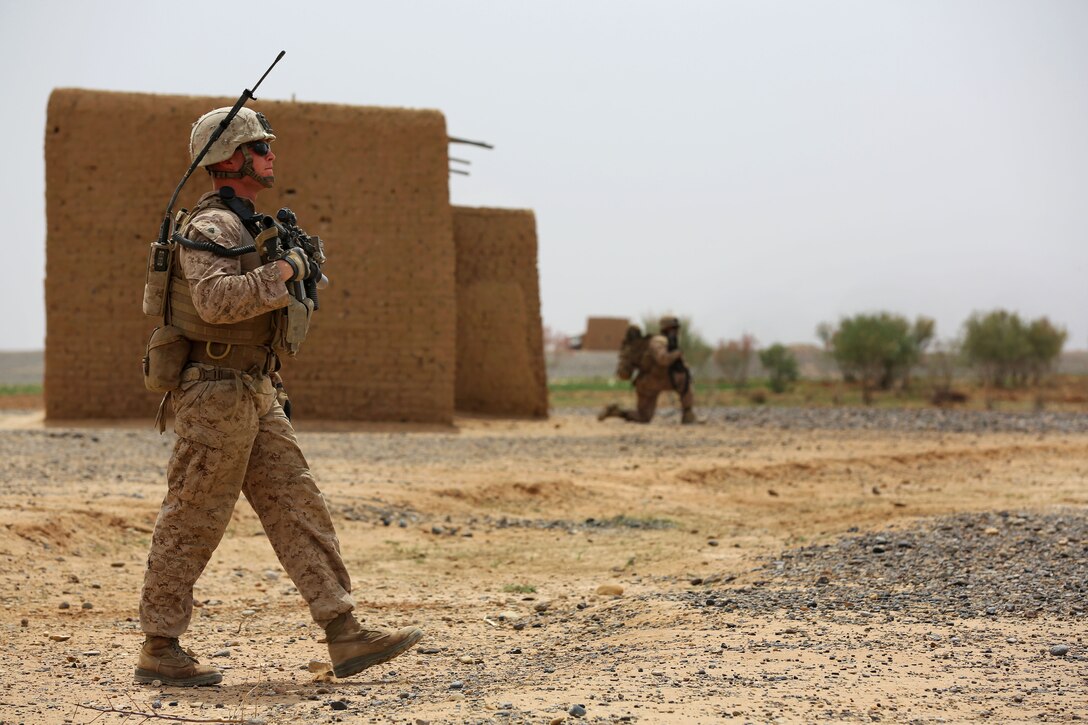 U.S. Marine Corps Cpl. Jordan Baxter, foreground, leads a patrol in Helmand province, Afghanistan, April 12, 2014. Baxter, a squad leader, is assigned to Weapons Company, 1st Battalion, 9th Marine Regiment.