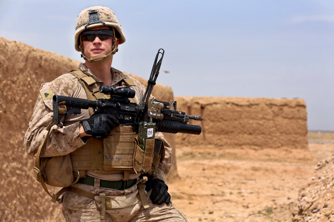U.S. Marine Corps Cpl. Eric McGovern provides security during a patrol in Helmand province, Afghanistan, April 12, 2014. McGovern, a fire team leader, is assigned to Weapons Company, 1st Battalion, 9th Marine Regiment.