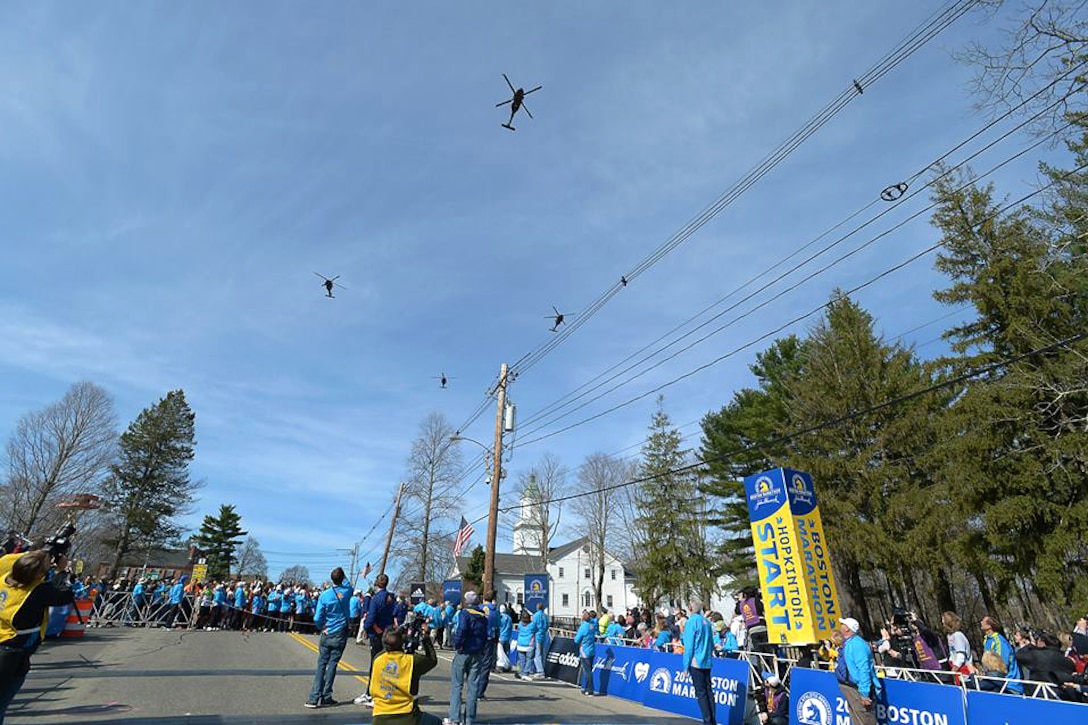 UH-60 M Black Hawk helicopters fly in formation before the start of the 2014 Boston Marathon in Hopkinton, Mass., April 21, 2014. The helicopter crews are assigned to the Massachusetts Army National Guard’s 3rd Battalion, 126th Aviation Regiment.