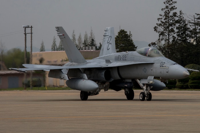 An F/A-18 hornet with Marine Fighter Attack Squadron 122 taxies down the runway aboard Gwangju Air Base, Republic of Korea, during Exercise Max Thunder 14-1, April 12, 2014. MT 14-1 is a semi-annual training event consisting of composite and coalition flight training between the U.S. military and the Republic of Korea Air Force.