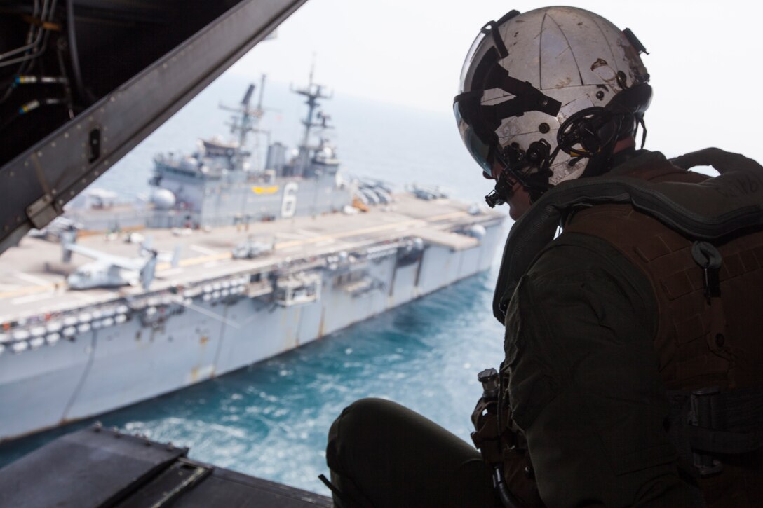 Staff Sgt. Cameron H. Depue, a crew chief with Marine Medium Tiltrotor Squadron 265 (Reinforced), 31st Marine Expeditionary Unit, and a native of Locustgrowth, Va., sits on the back of an MV-22 Osprey as it departs from the USS Bonhomme Richard (LHD 6) during search and rescue operations in response to the sunken ferry Sewol off the coast of the Republic of Korea, April 21. The 31st MEU and Amphibious Squadron 11 (PHIBRON) had just completed participation in exercise Ssang Yong ’14 and were roughly 100 nautical miles away when they were tasked to respond to the incident April 16.  The 31st MEU and PHIBRON 11 provide a forward deployed maritime contingency response force capable of conducting a wide range of amphibious operations in the Asia-Pacific region. 