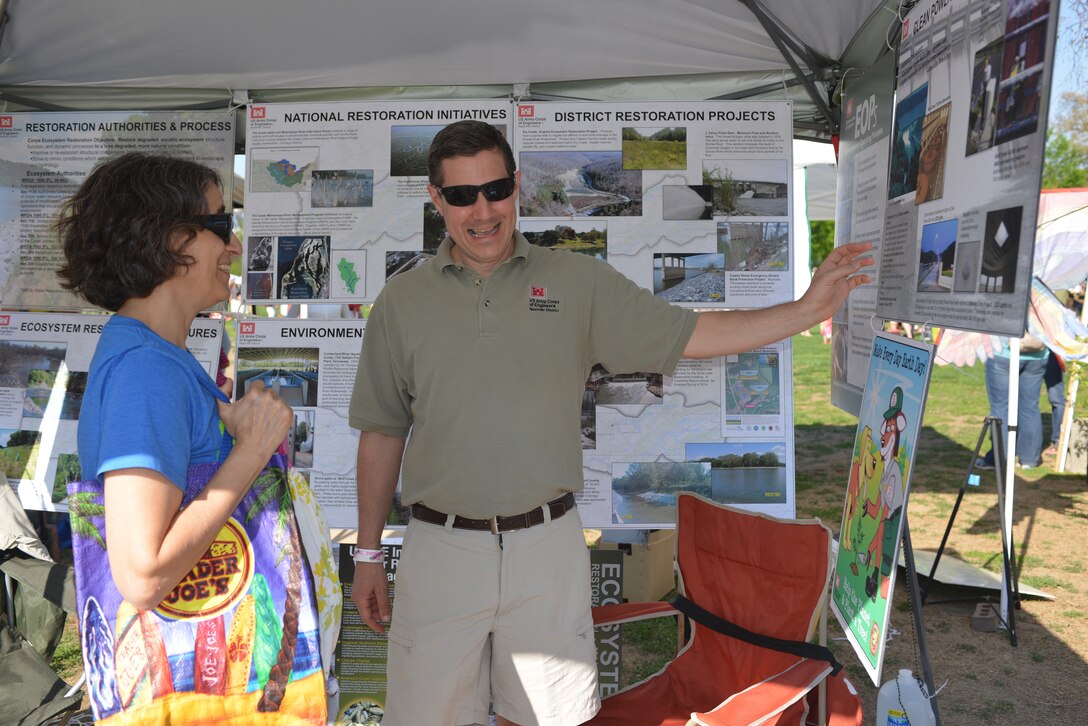 Craig Carrington, chief plan formulation Section explains various projects and work the Corps has done to Diane Shearfrom Nashville at the 13th annnual Nashville Earth Day Festival at Centennial Park April 19, 2014.  