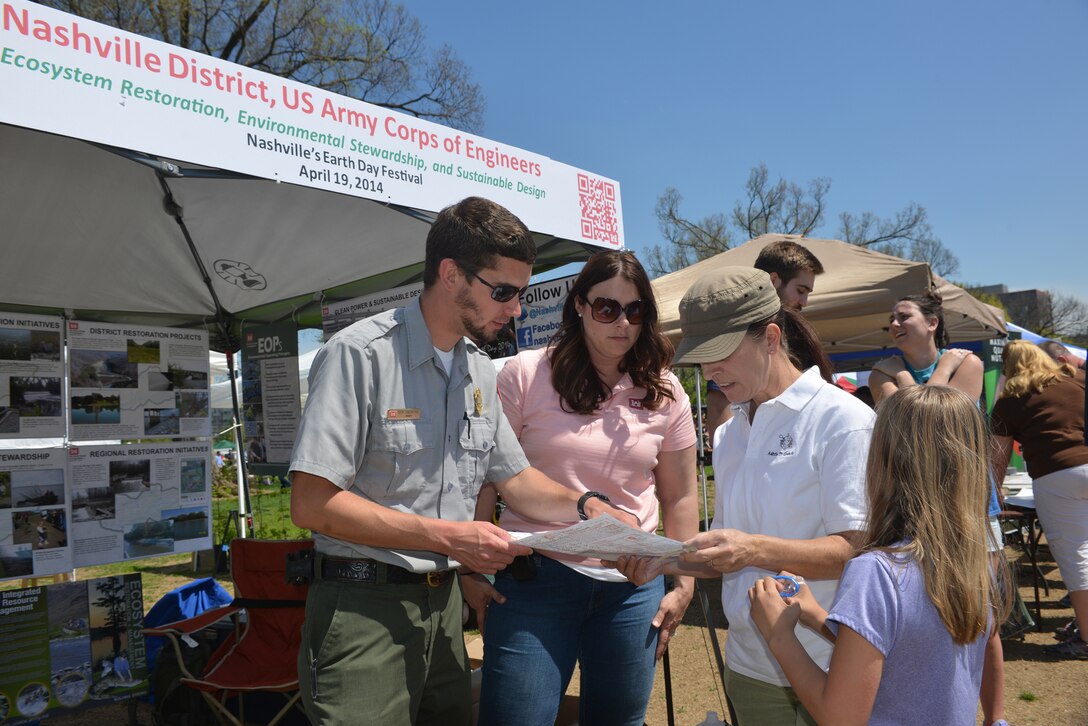Ben MacIntyre, a park ranger from J. Percy Priest Lake Resource Center and Mary Lewis, biologist, Customer Outreach and Silver Jackets coordinator with the U.S. Army Corps of Engineers, Nashville District, talk with residents of the J. Percy Priest lake area at the 13th annual Nashville Earth Day Festival at Centennial Park April 19.  