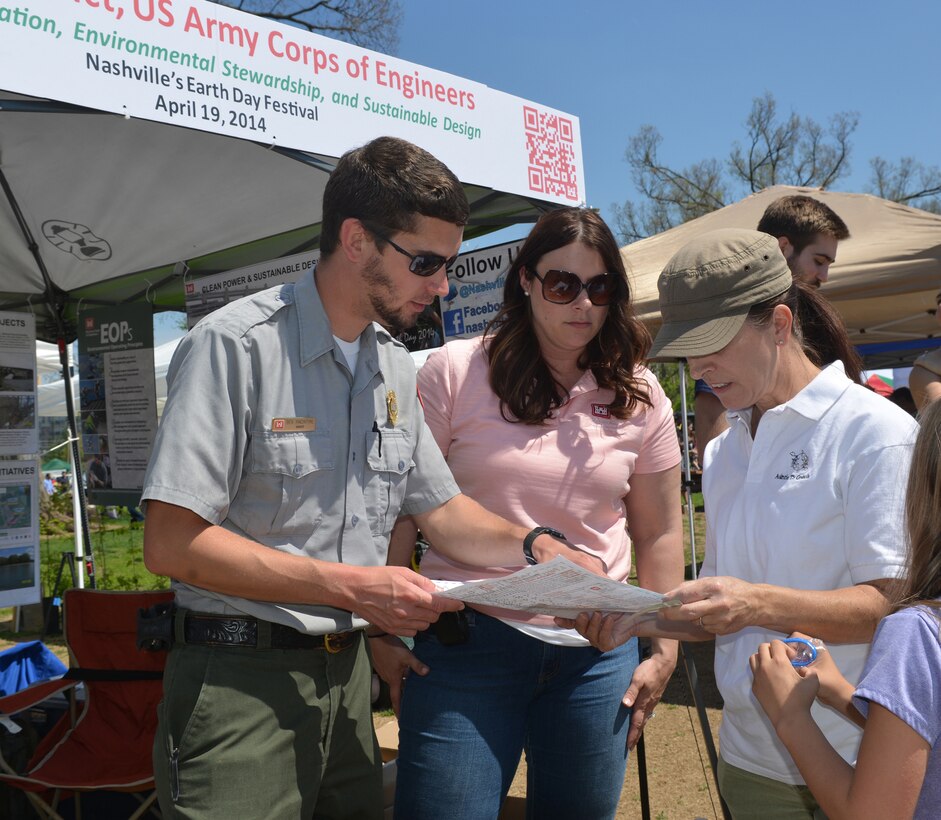 Ben MacIntyre, a park ranger from J. Percy Priest Lake Resource Center and Mary Lewis, biologist, Customer Outreach and Silver Jackets coordinator with the U.S. Army Corps of Engineers, Nashville District, talk with residents of the J. Percy Priest lake area at the 13th annual Nashville Earth Day Festival at Centennial Park April 19.  
