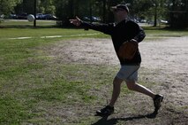 Sgt. Maj. Rodger Newcomb, the sergeant major of 2nd Supply Battalion, Combat Logistics Regiment 25, 2nd Marine Logistics Group pitches a softball during a field meet aboard Camp Lejeune, N.C., April 16, 2014. The field meet allowed Marines and sailor at every level in the regiment to get involved and have fun.