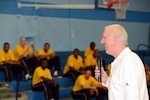 Four-time NBA champion San Antonio Spurs coach Gregg Popovich answers questions Monday from players in the 2012 Armed Forces Men's Basketball Championships while All-Army players listen in the backdrop at Chaparral Fitness Center on Lackland Air Force Base in San Antonio. Tournament play begins tonight with All-Marine Corps vs All-Navy at 5 p.m., followed by All-Army vs. All-Air Force at 7:30 p.m. U.S. Army photo by Tim Hipps, IMCOM Public Affairs