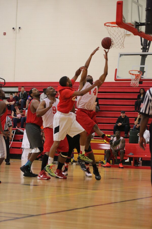 Nardarius Durr, a player for the Headquarters and Service Bn. Finance Section intramural basketball team, jumps to make a basket during the Quantico Intramural Basketball Championship Game against the H&S Bn. team at Barber Physical Activity Center on April 17, 2014. The H&S Bn. team kept the score close the whole game but couldn't take the lead and lost, 65-56.