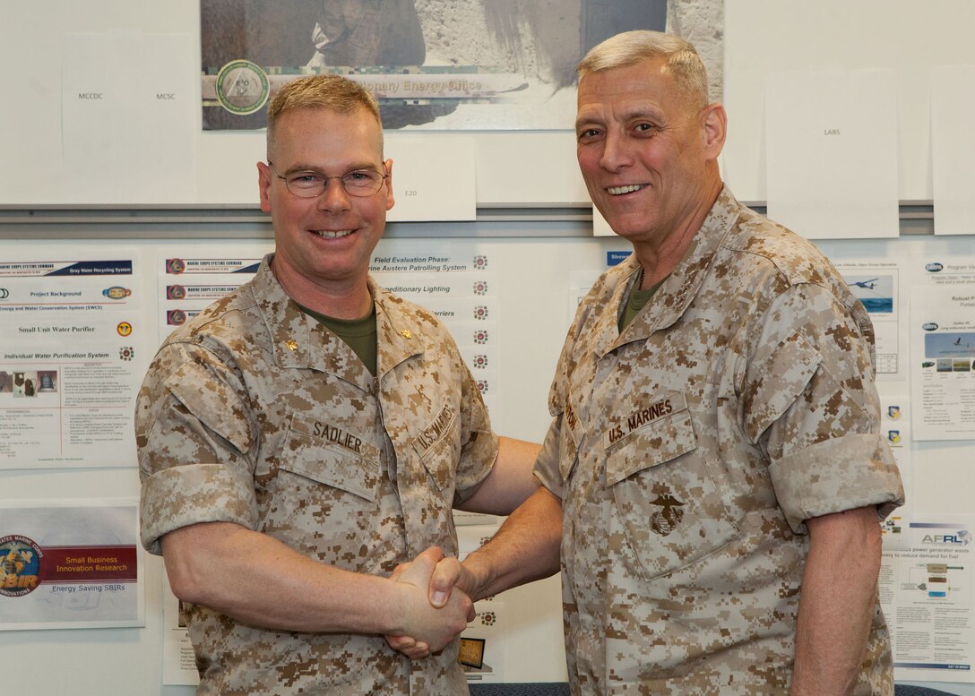 The Assistant Commandant of the Marine Corps, Gen. John M. Paxton, Jr., right, poses for a photo with Maj. Sadlier at the Pentagon, Arlington Va., April 22, 2014. (U.S. Marine Corps photo by Cpl. Tia Dufour/Released)