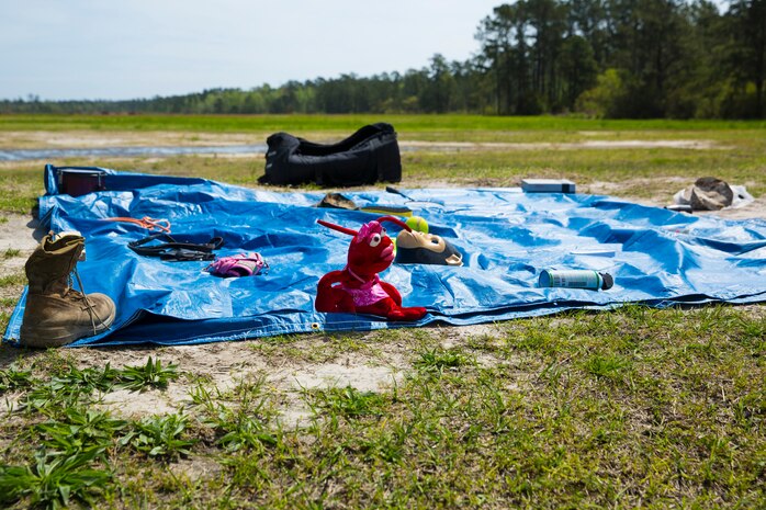 Random items lay scattered across a tarp as part of the “Kim’s game” during a super squad competition aboard Camp Lejeune, N.C., April 17, 2014. Marines with 2nd Maintenance Battalion, 2nd Marine Logistics Group had to remember the items and their placement after hiking and completing challenges throughout the day. (U.S. Marine Corps photo by Cpl. Shawn Valosin)