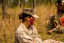 A simulated casualty waits for treatment from Marines with 2nd Maintenance Battalion, 2nd Marine Logistics Group during a super squad competition aboard Camp Lejeune, N.C., April 17, 2014. The treatment and evacuation of casualties was one of many challenges squads faced during the competition. (U.S. Marine Corps photo by Cpl. Shawn Valosin)