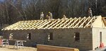New York National Guard troops install roof sheathing on a building at the Joint Multinational Readiness Center in Germany in March, 2014.