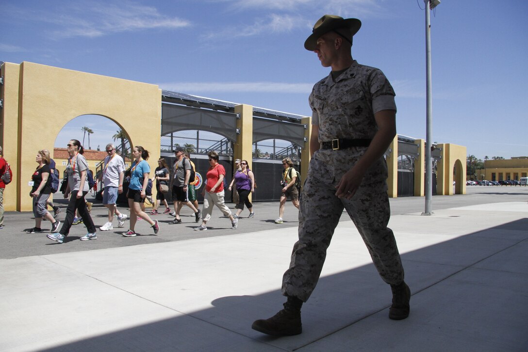 Staff Sgt. Theodoor A. Steber, a drill instructor, marches educators during the Educators' Workshop at Marine Corps Recruit Dept San Diego April 8, 2014. The educators were instructed on the proper response to common terms during recruit training, such as "eyeballs" and "ears." 