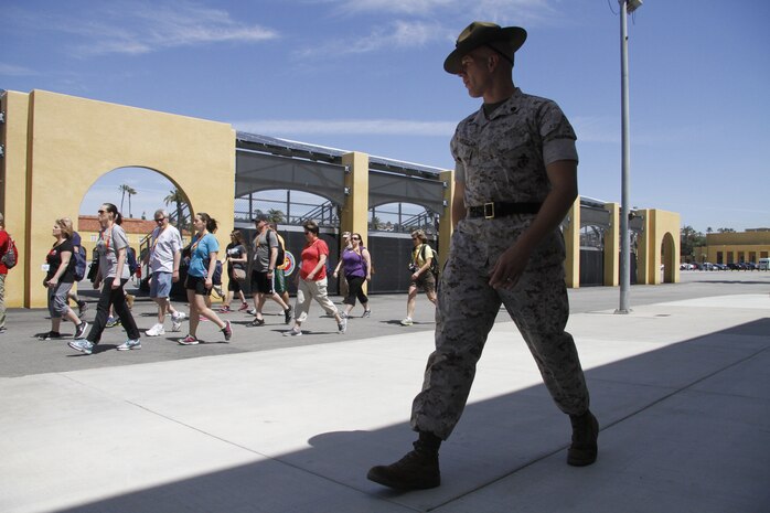 Staff Sgt. Theodoor A. Steber, a drill instructor, marches educators during the Educators' Workshop at Marine Corps Recruit Dept San Diego April 8, 2014. The educators were instructed on the proper response to common terms during recruit training, such as "eyeballs" and "ears." 