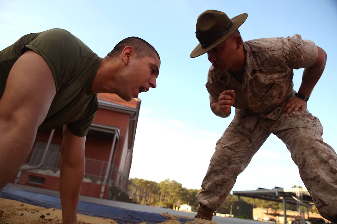 Staff Sgt. Brian Sixto, a drill instructor for Platoon 3034, encourages Rct. Edgar Barua-Gomez, Platoon 3034, Mike Company, 3rd Recruit Training Battalion, to respond to orders March 12, 2014, during an incentive training session on Parris Island, S.C. Discipline, defined as the instant and willing obedience to all orders, respect for authority and self-reliance, is a key trait drill instructors like Sixto, 28, from Hobson, Texas, must instill in recruits. Barua-Gomez, 23, from Kensington, Md., is scheduled to graduate May 23, 2014. Parris Island has been the site of Marine Corps recruit training since Nov. 1, 1915. Today, approximately 20,000 recruits come to Parris Island annually for the chance to become United States Marines by enduring 13 weeks of rigorous, transformative training. Parris Island is home to entry-level enlisted training for 50 percent of males and 100 percent of females in the Marine Corps. (Photo by Cpl. Caitlin Brink)
