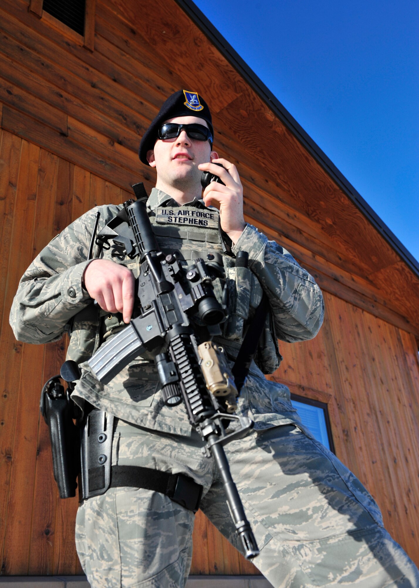 Airman 1st Class Charles Stephens, 354th Security Forces Squadron response force leader, communicates with the Base Defense Operations Center April 17, 2014, Eielson Air Force Base, Alaska. Stephens was recently selected as 1 of 50 enlisted Airmen to attend the Air Force Academy Preparatory School. (U.S. Air Force photo by Senior Airman Ashley Nicole Taylor/Released)