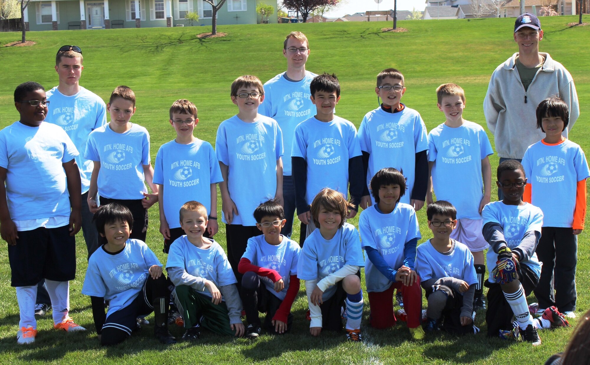 The Mountain Home Air Force Base Youth Center-sponsored “Thunderbolts,” team poses for a photo after their soccer game at Legacy Park in Mountain Home town, April 19, 2014. The team consists of: Brayden Shields, Davis Saunders, Matthew Johnson, Kell Iverson, Liam Wallace, Ethan Ferguson, Casey Sitton, Enzo Yeo, Hagen Flahaut, Donovan Gordon, Eason and Elton Li, Donte Brazell, Kalib Ferguson, and Cyrus and Skylar Tham. The team is coached by Airman 1st Class Zachary McGrew, 366th Comptroller Squadron, Airman 1st Class John Eckart, 726th Air Control Squadron. and Lt. Col. Jeremy Saunders, 366th Aircraft Maintenance Squadron commander. (Courtesy photo)