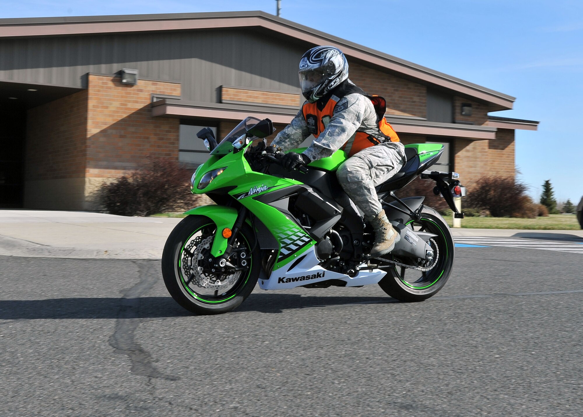 Tech. Sgt. Jerome Stevenson rides a motorcycle on base wearing the correct personal protection equipment as motorcycle season begins. Stevenson is the 92nd Civil Engineer Squadron and 92nd Air Refueling Wing Inspector General Wing Management Internal Control Toolset manager.  (U.S. Air Force photo by Staff Sgt. Veronica Montes) 
