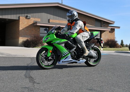 Tech. Sgt. Jerome Stevenson rides a motorcycle on base wearing the correct personal protection equipment as motorcycle season begins. Stevenson is the 92nd Civil Engineer Squadron and 92nd Air Refueling Wing Inspector General Wing Management Internal Control Toolset manager.  (U.S. Air Force photo by Staff Sgt. Veronica Montes) 