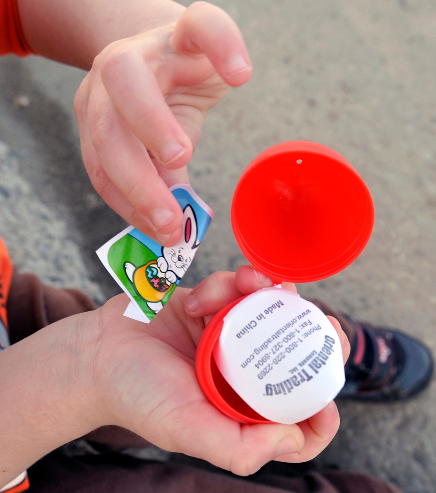 A child finds a sticker in an Easter egg during the Easter Eggstravaganza on Joint Base Elmendorf-Richardson, Alaska, April 19, 2014. Stickers, candy and plastic toys were hidden in each plastic Easter egg for the hunt. More than 2,000 military members and their families participated in this year’s Easter Eggstravaganza. (U.S. Air Force photo/Airman 1st Class Tammie Ramsouer)