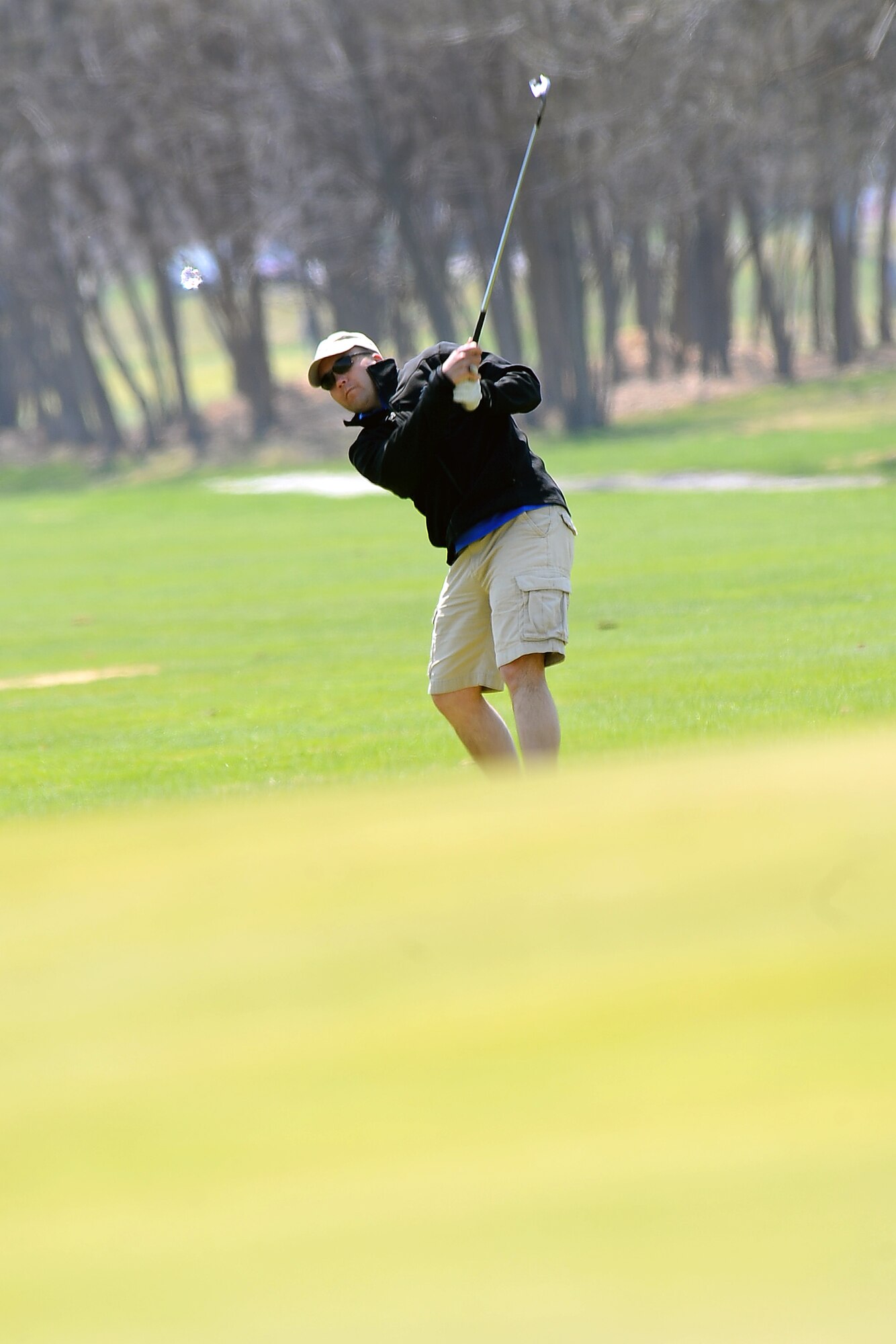 U.S. Air Force Lt. Col. John Litecky, incoming 55th Operations Support Squadron commander, chips his way onto the green while participating in the annual Sexual Assault Awareness Month golf tournament held at the Willow Lakes Golf Course, Neb. April 18.  The tournament is made possible with the efforts of both the 55th Wing First Sergeants organization as well as the Sexual Assault Response Coordinator.  The Golf tournament is the marquee event of Sexual Assault Awareness Month.  (U.S. Air Force photo by Josh Plueger/Released)