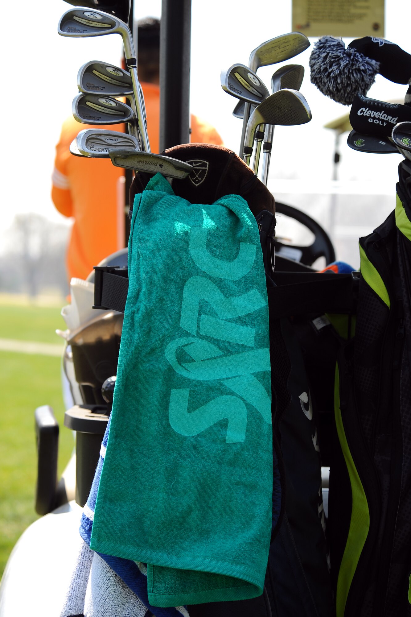 A teal golf towel, with the Sexual Assault Response Coordinator logo, hangs from a Golf Bag at the annual golf tournament held at Willow Lakes Golf Course, Neb., April 18. Team Offutt golfers came together to recognize and express support for Sexual Assault Awareness Month.   (U.S. Air Force photo by Josh Plueger/Released)