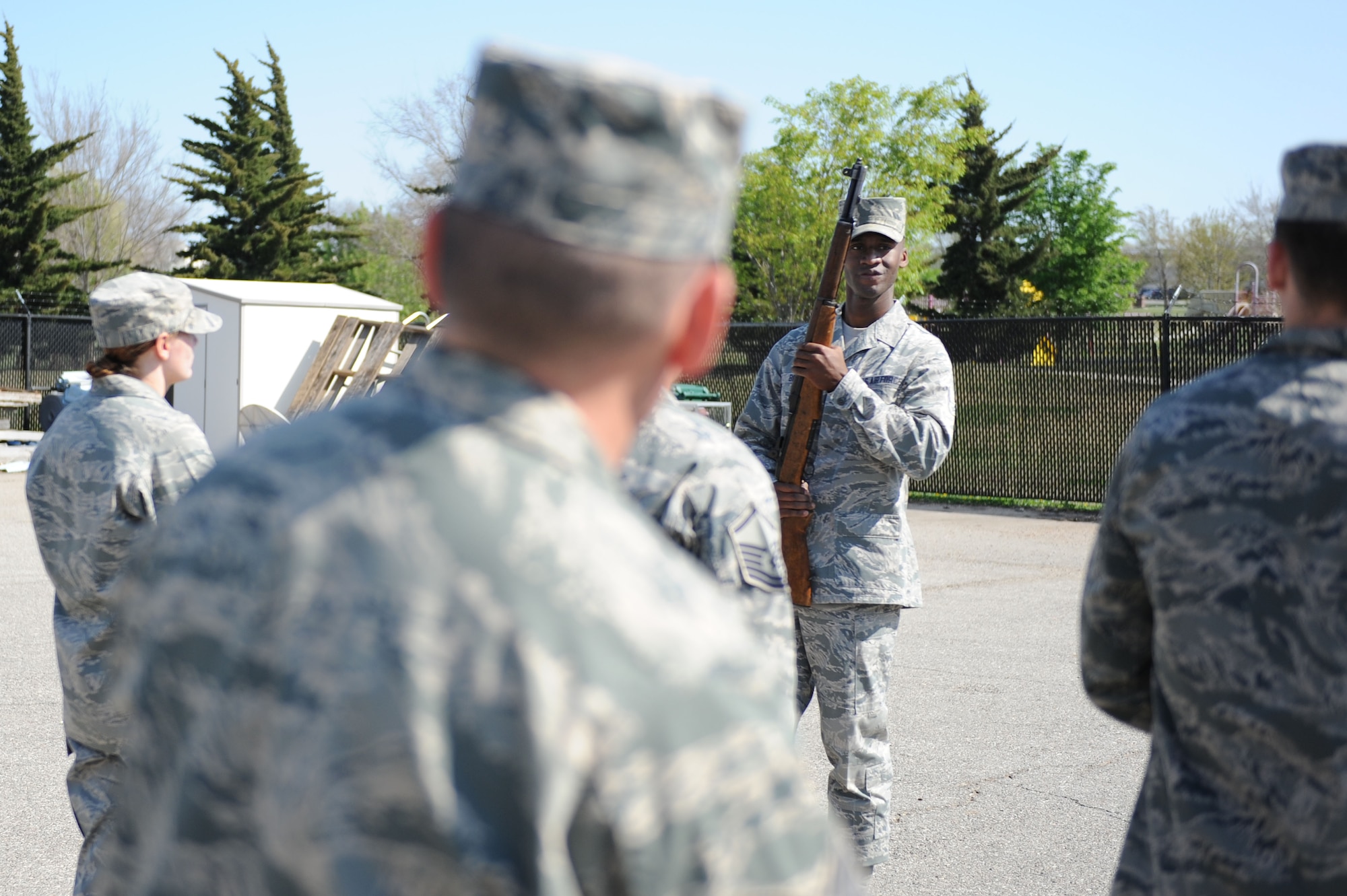 Airman 1st Class London Brown, Air Force Honor Guard training flight instructor, teaches proper drill procedures to Airmen from the 22nd Air Refueling Wing and the Kansas Air National Guard, April 22, 2014, at McConnell Air Force Base, Kan. Brown and his fellow Airmen travel to various bases to ensure base honor guards are consistent with Air Force Honor Guard standards and procedures. (U.S. Air Force photo/Airman 1st Class David Bernal Del Agua)  