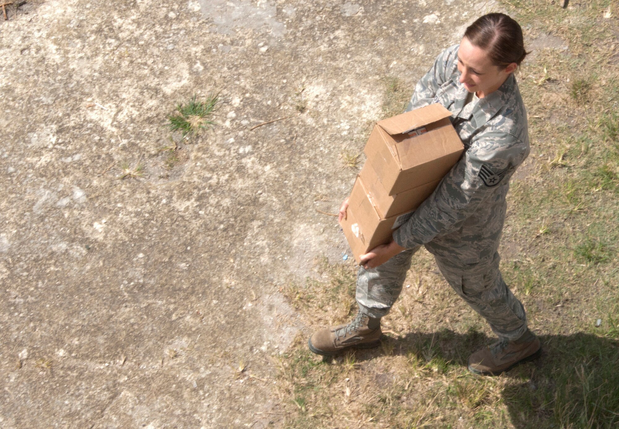 U.S. Air Force Staff Sgt. Molly Cox, New Horizons medical logistics, carries a box of while packing up operations at the school on the final day of the medical readiness training exercises April 17, 2014, in Libertad, Belize. The exercises, also known as MEDRETES, offered U.S. and Canadian military doctors and nurses the opportunity to train and interact with their Belizean counterparts while providing free health care to Belizean residents. (U.S. Air Force photo by Tech. Sgt. Kali L. Gradishar/Released)


