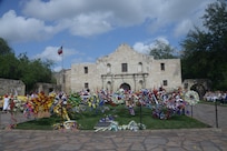 Wreaths are placed in front of the Alamo in honor of the fallen during the annual San Antonio Fiesta Pilgrimage to the Alamo April 21. The pilgrimage is a memorial tribute to the Alamo heroes and the heritage of Texas. (U.S. Air Force photo by Joel Martinez)