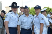 Tech. Sgt. Daniel Anderson from the 323rd Training Squadron and 2014 military ambassador, Chief Master Sgt. Gerardo Tapia, command chief master sergeant for Air Education and Training Command and Staff Sgt. Kathryn North from the 382nd Training Squadron and 2014 military ambassador, pose for a photo April 21 before the annual San Antonio Fiesta Pilgrimage to the Alamo event. The wreath-bearing procession is a solemn occasion during which historic, civic, patriotic, military and school groups depart Municipal Auditorium and walk silently to the Alamo. (U.S. Air Force photo by Joel Martinez) 