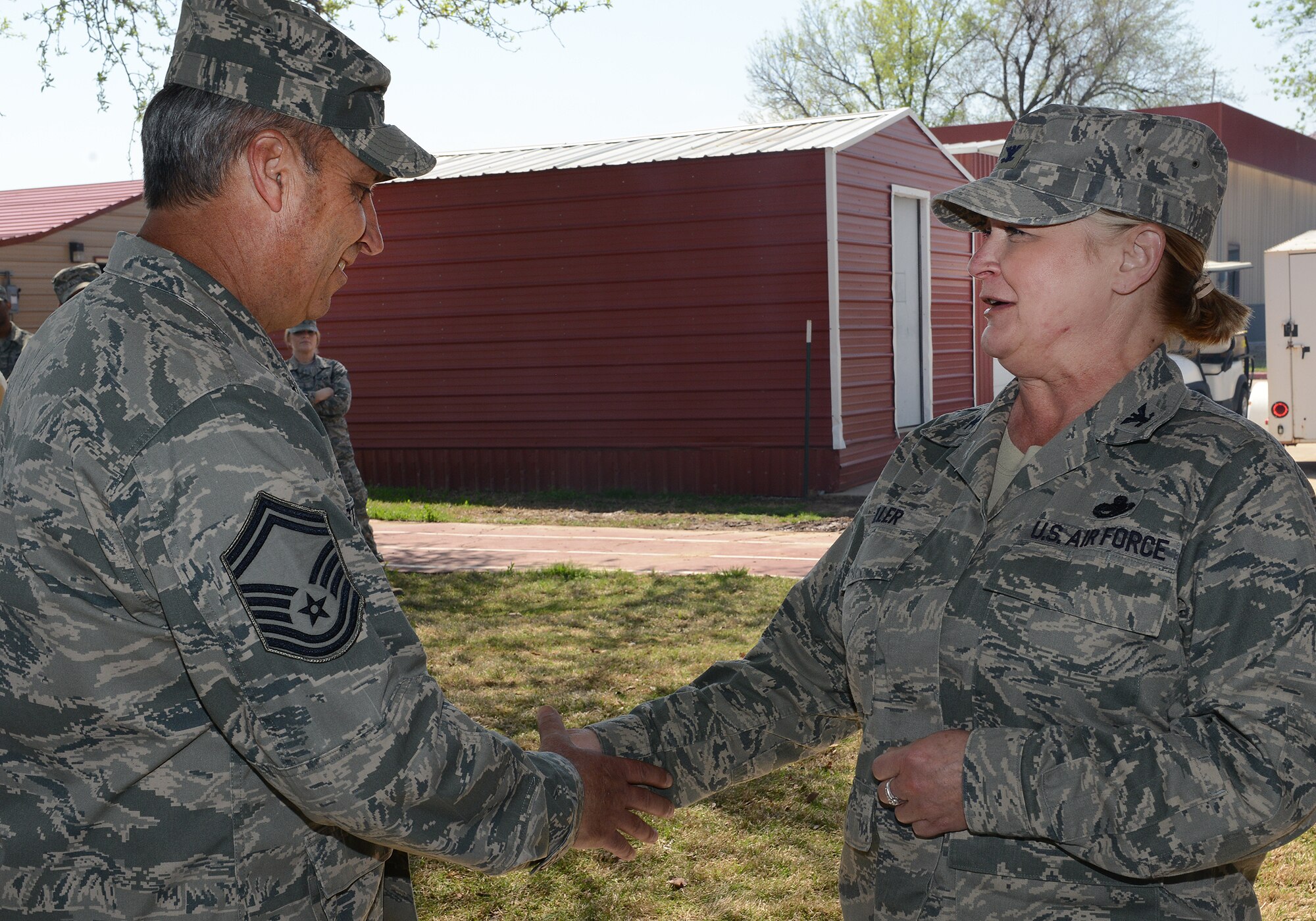 Colonel Rita Miller, 138th Mission Support Group Commander, recognizes Senior Master Sergeant Shawn Strohmeyer for his ESOHCAMP preparation efforts during an Earth Day celebration at the 138th Fighter Wing, 22 April 2014.  The 138th FW Environmental Management office organized a cookout and other green activities to celebrate the day at the Tulsa Air National Guard base, Tulsa Okla.  (U.S. National Guard photo by Senior Master Sgt.  Preston L. Chasteen/Released)