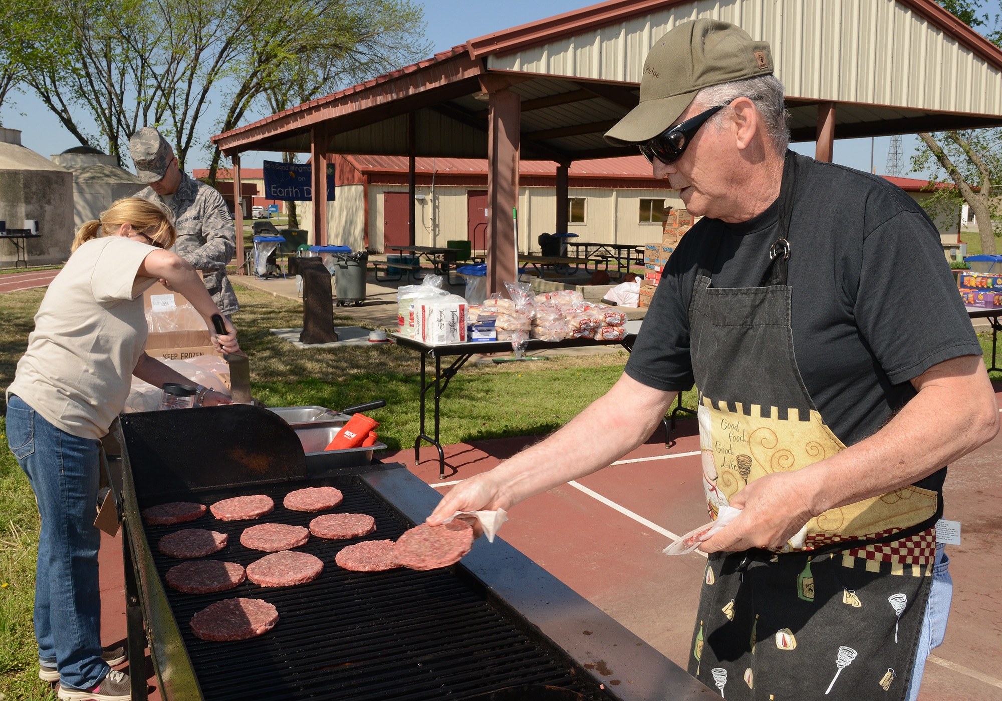 Master Sergeant Don Herbert (Ret.) cooks hamburgers in preparation for Earth Day celebration at the 138th Fighter Wing, 22 April 2014.  The 138th FW Environmental Management office organized a cookout and other green activities to celebrate the day at the Tulsa Air National Guard base, Tulsa Okla.  (U.S. National Guard photo by Senior Master Sgt.  Preston L. Chasteen/Released)