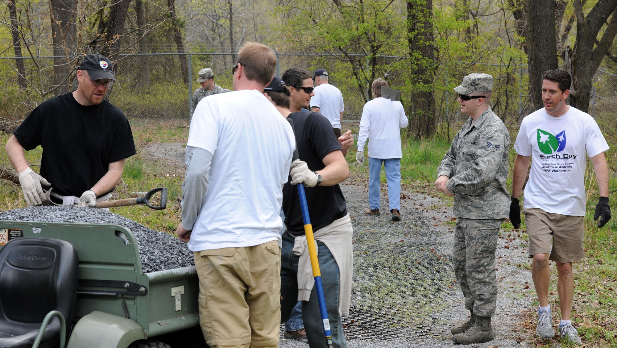 Members of Joint Base Andrews gather to spread gravel on worn areas of a trail here in recognition of the 44th Annual Earth Day, April 22, 2014. Earth Day is celebrated to focus on environmental clean-up and awareness. (U.S. Air Force photo/Airman 1st Class Ryan J. Sonnier) 