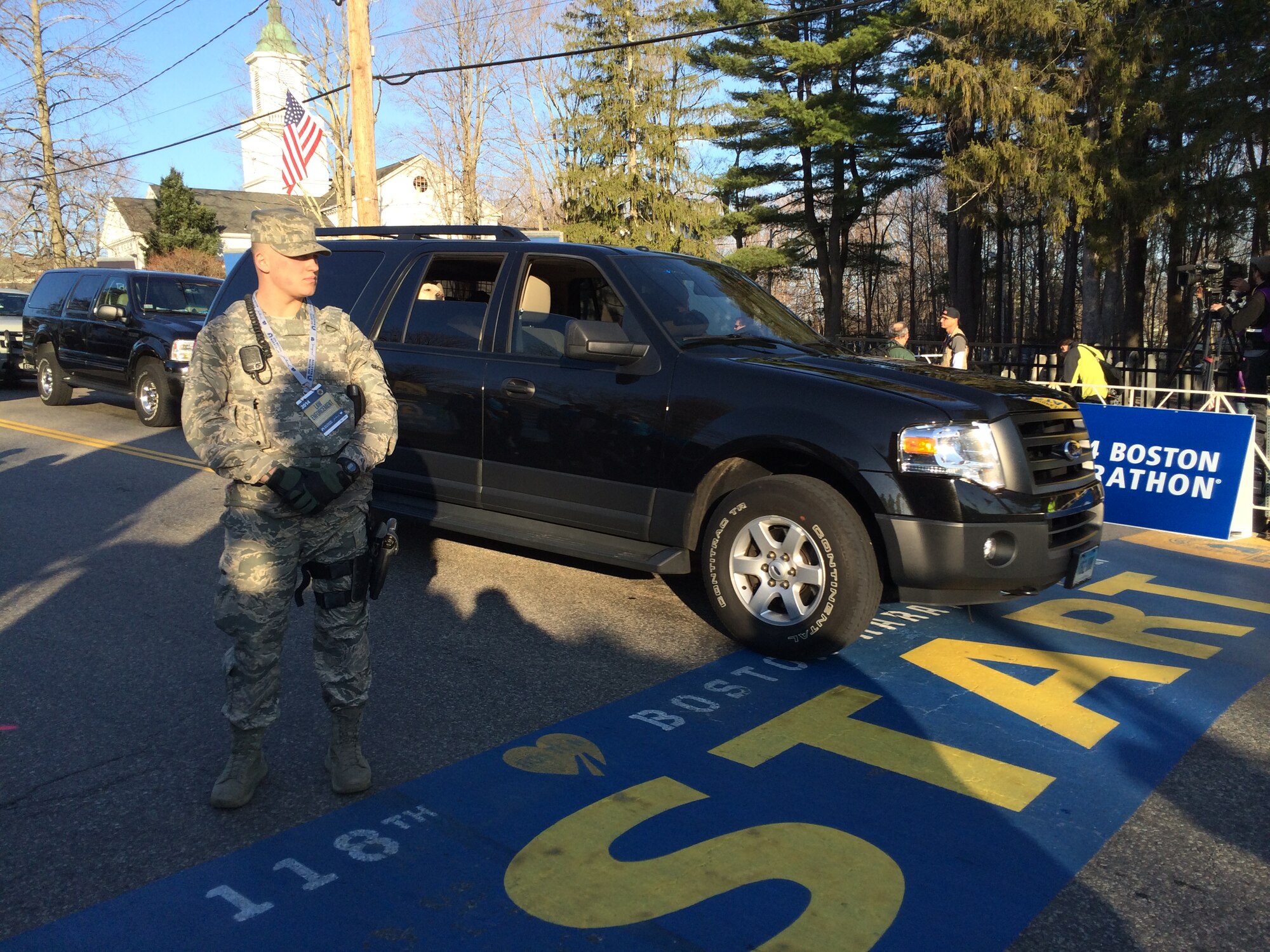 Airman 1st Class Eric Lapworth, Security Forces, 102nd Intelligence Wing, Massachusetts Air National Guard, provides traffic control for law enforcement agencies at the start of the 118th Boston Marathon in Hopkinton, Mass., April 21st. (U.S. Army National Guard photo by Sgt. 1st Class James C. Lally, Massachusetts National Guard Public Affairs /Released)
 
