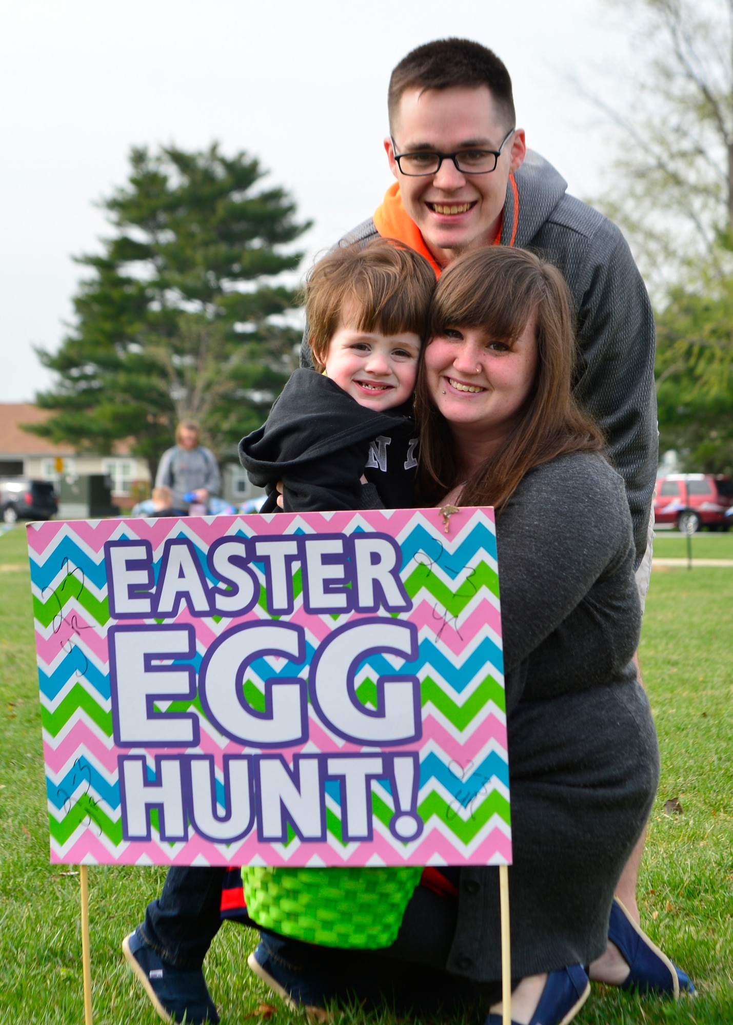 Mark Owens, 436th Force Support Squadron sports program manager, poses for a photo with his wife, Jessie Owens, and son, Kaleb Owens, after an Easter Egg hunt April 19, 2014, at the Youth Center on Dover Air Force Base, Del. Kaleb hunted for Easter eggs in the 2 to 3 year old age category. (U.S. Air Force photo/Airman 1st Class William Johnson)
