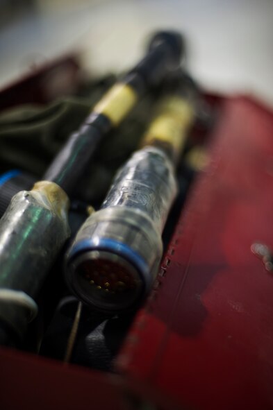 Weapon load crews prepare their tool boxes before a weapons-loading competition begins at Minot Air Force Base, N.D., April 17, 2014. Each load crew consists of four Airmen who are evaluated every month on how well they load various types of weapons. (U.S. Air Force photo/Senior Airman Brittany Y. Auld)