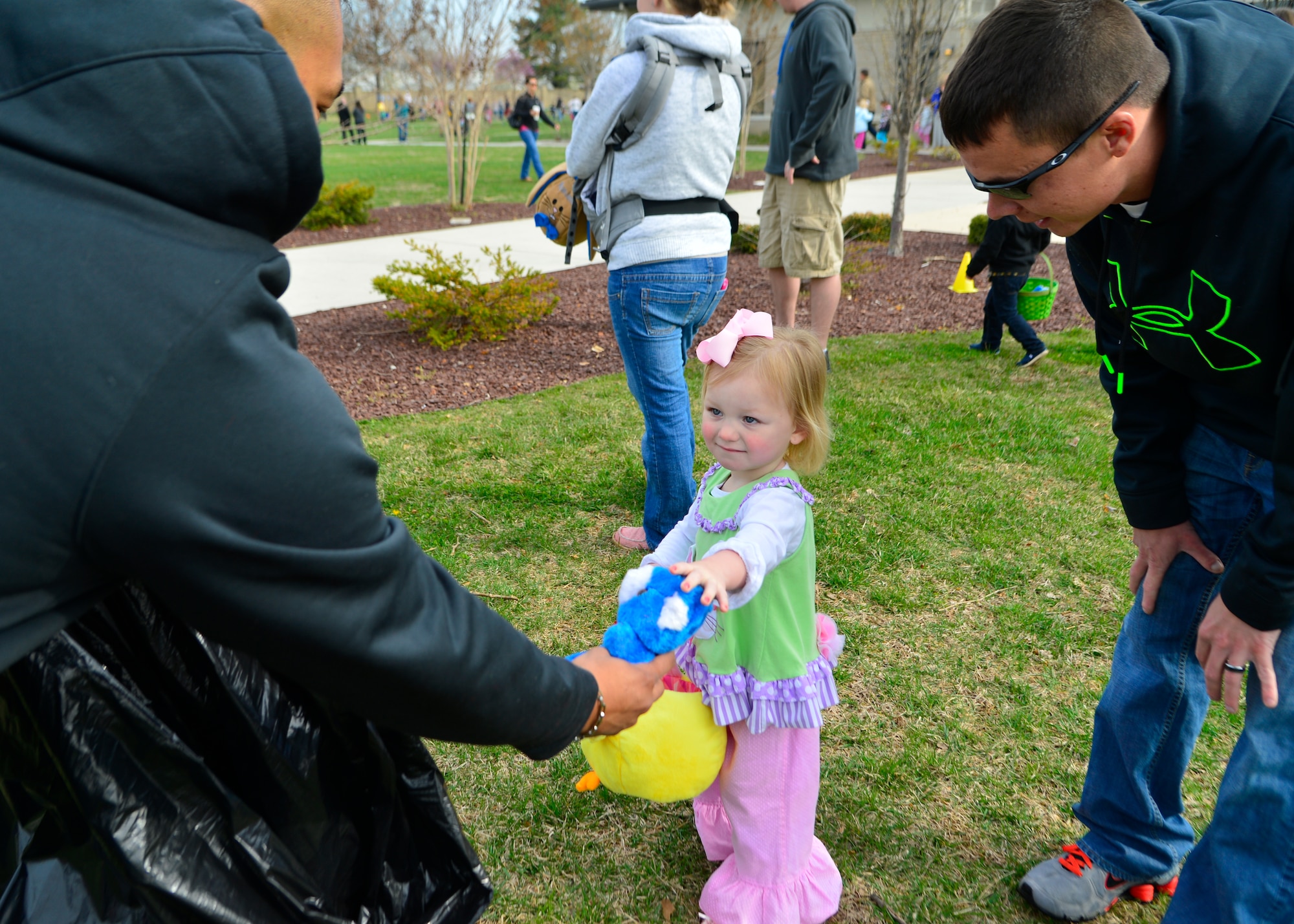 Adalyn Johnson, daughter of Senior Airman Adam Johnson, 436th Aerial Port Squadron information controller, receives a stuffed bear during an Easter egg hunt April 19th, 2014, at the Youth Center on Dover Air Force Base, Del. Volunteer Airmen handed out a variety of stuffed bears to children that participated in the hunt. (U.S. Air force photo/Airman 1st Class William Johnson)