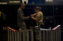 Airman 1st Class Dustin Lumpkin and Senior Airman Kasey Castor, 5th Aircraft Maintenance Squadron weapons load crew members, prepare their tool kits before a weapons-loading competition begins at Minot Air Force Base, N.D., April 17, 2014. As part of Air Force Global Strike Command, load crews work endlessly to preserve our nation’s security by providing combat-ready forces for nuclear deterrence and global strike operations. (U.S. Air Force photo/Senior Airman Brittany Y. Auld)