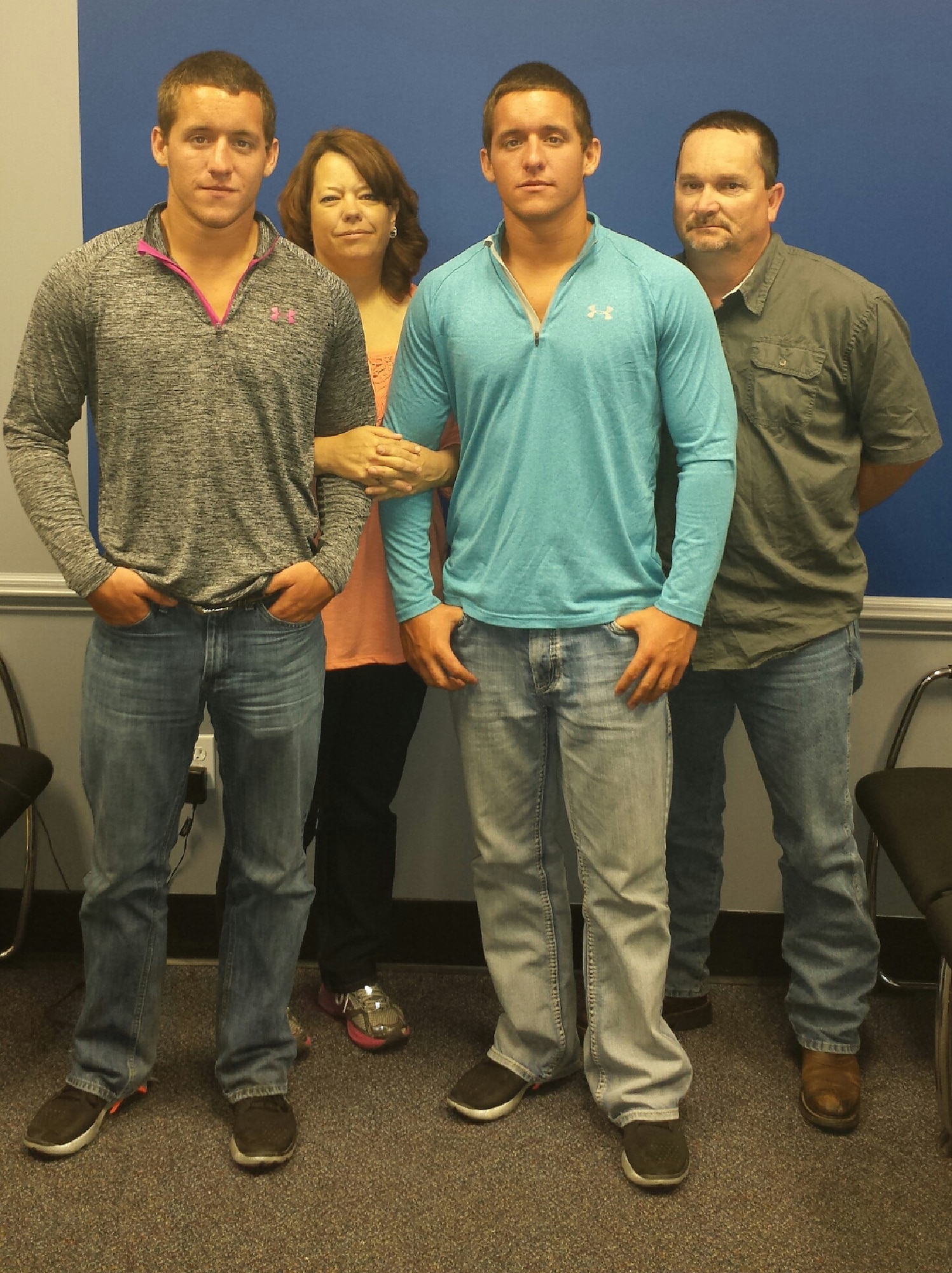 Twin brothers Dustin (in gray) and Dillon Yancy pose with their parents, James and Tonya Yancy, at the recruiting office in Memphis, Tenn. (Courtesy photo)
