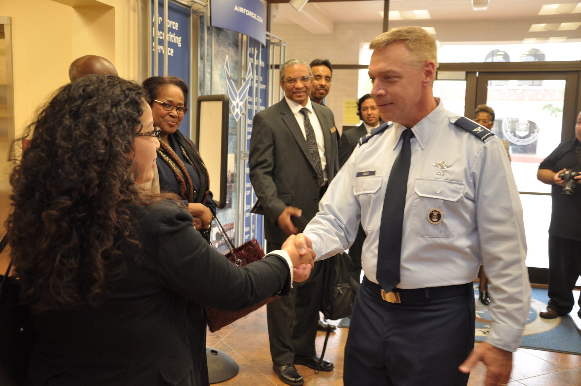 Col. Robert D. Ament, Air Force Recruiting Service mobilization assistant to the commander, greets members of the Alamo City Chamber of Commerce at Joint Base San Antonio-Randolph, Texas, April 17. Ament briefed the visitors on the AFRS mission. (U.S. Air Force photo/Tech. Sgt. Hillary Stonemetz)