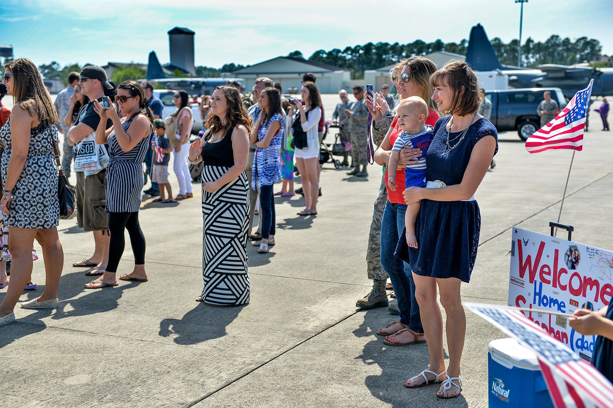 Danna and Max Shurn, wait for their Airman, Capt. Stephen Shurn, 15th Special Operations Squadron navigator, on Hurlburt Field, Fla., April 21, 2014. Airmen from the 15th SOS and 9th Special Operations Squadron returned from a deployment. (U.S. Air Force photo/Senior Airman Christopher Callaway)