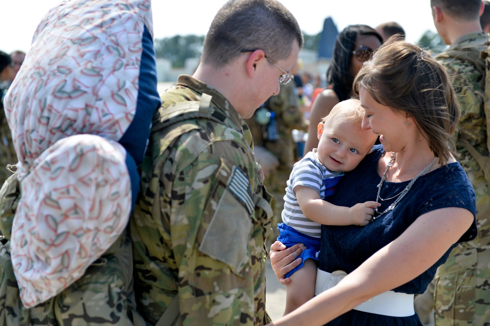 Danna and Max Shurn, greet their Airman, Capt. Stephen Shurn, 15th Special Operations Squadron navigator, on Hurlburt Field, Fla., April 21, 2014. Airmen from the 15th SOS and 9th Special Operations Squadron returned from a deployment. (U.S. Air Force photo/Senior Airman Christopher Callaway)