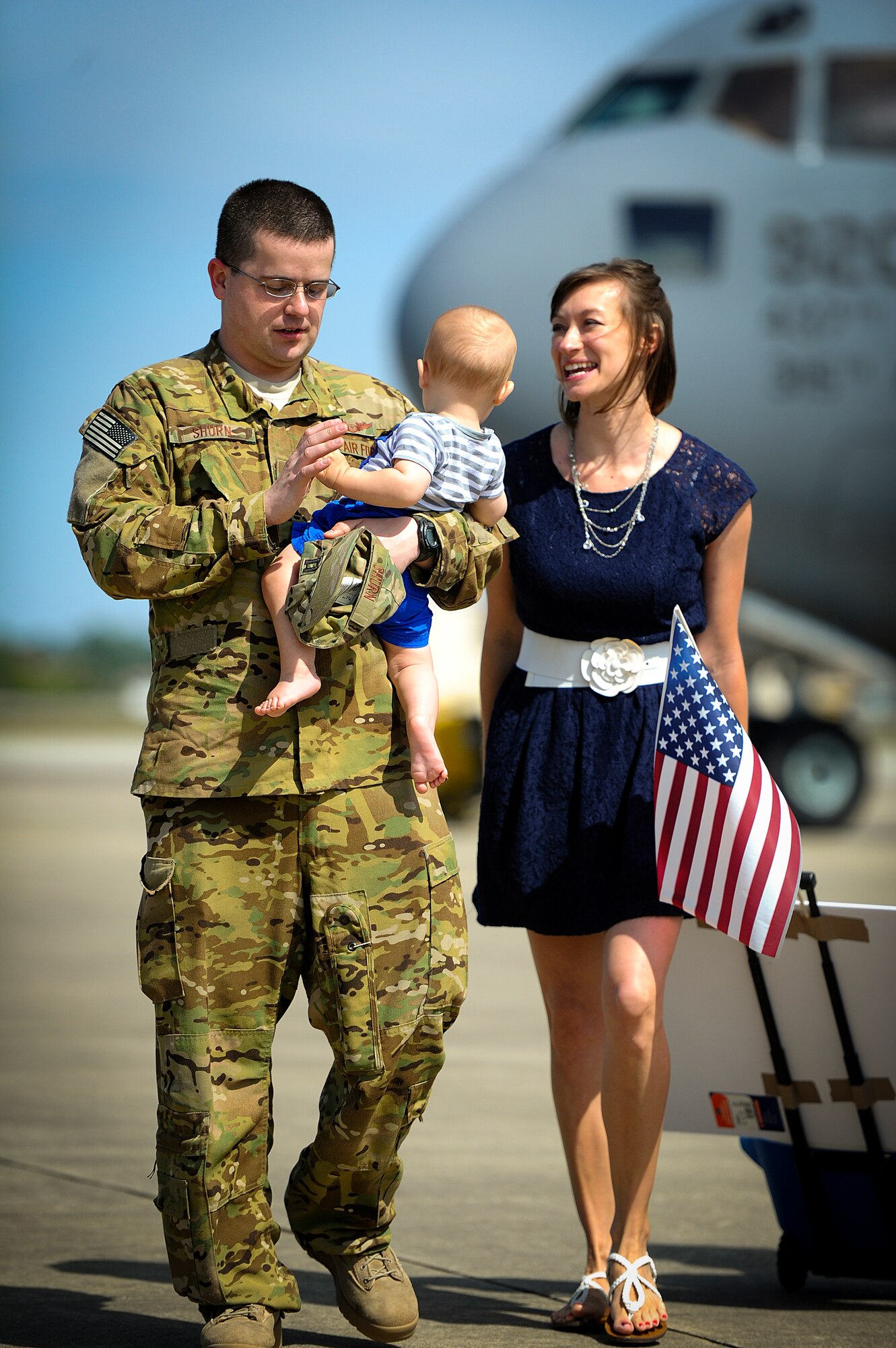 Danna and Max Shurn, greet their Airman, Capt. Stephen Shurn, 15th Special Operations Squadron navigator, on Hurlburt Field, Fla., April 21, 2014. Airmen from the 15th SOS and 9th Special Operations Squadron returned from a deployment. (U.S. Air Force photo/Senior Airman Christopher Callaway)