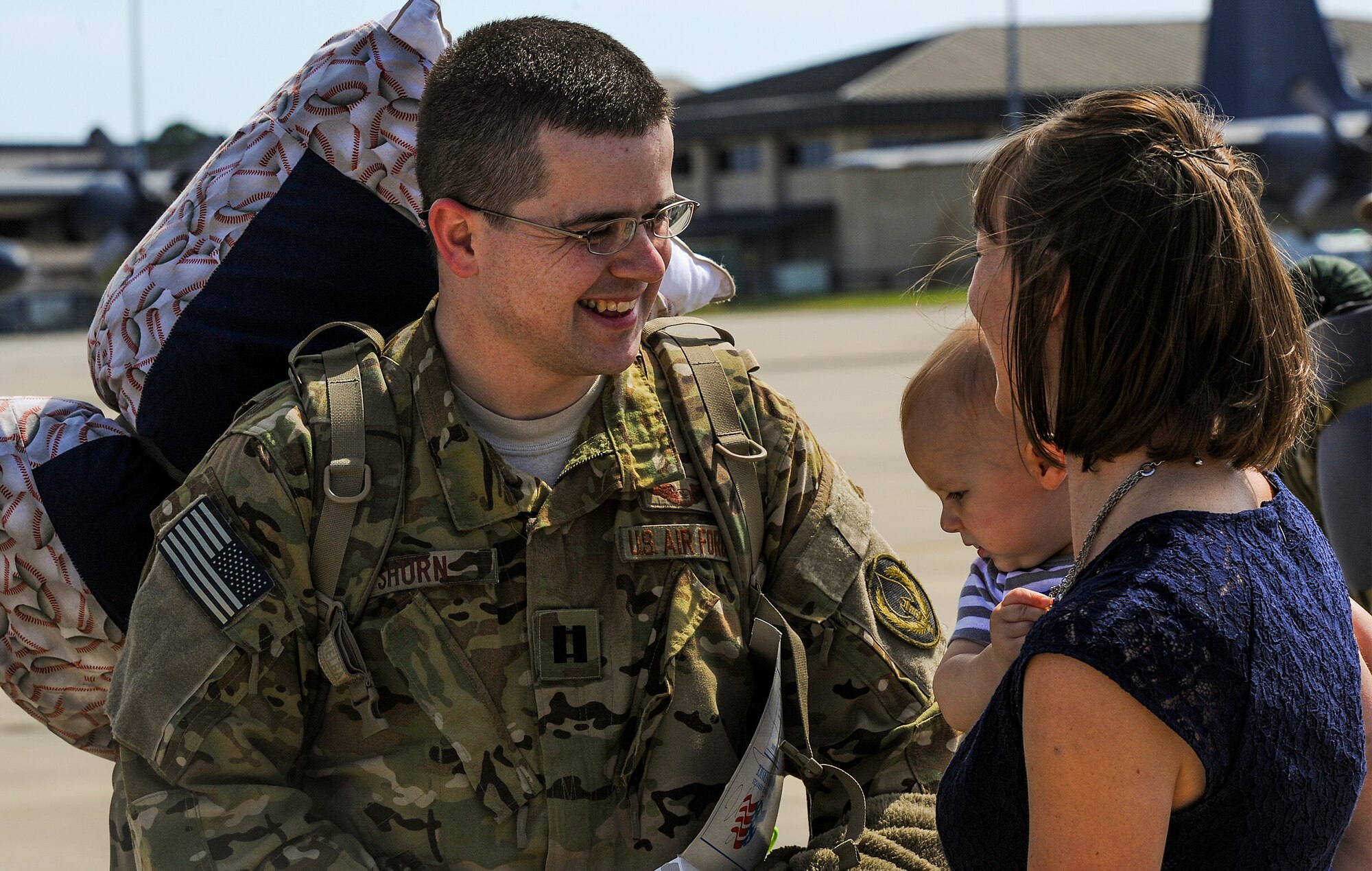 Danna and Max Shurn, greet their Airman, Capt. Stephen Shurn, 15th Special Operations Squadron navigator, on Hurlburt Field, Fla., April 21, 2014. Airmen from the 15th SOS and 9th Special Operations Squadron returned from a deployment. (U.S. Air Force photo/Senior Airman Christopher Callaway)