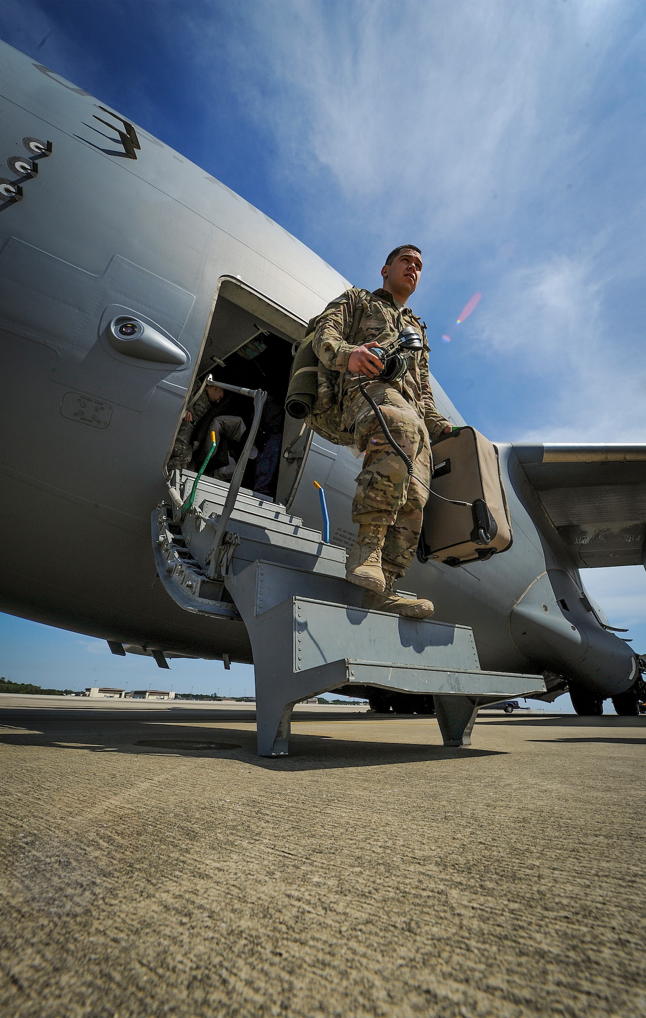 Members of the 9th Special Operations Squadron and 15th Special Operations Squadron return from deployment on Hurlburt Field, Fla., April 21, 2014. The Airmen landed on the flightline aboard a C-17 Globemaster III. (U.S. Air Force photo/Senior Airman Christopher Callaway)