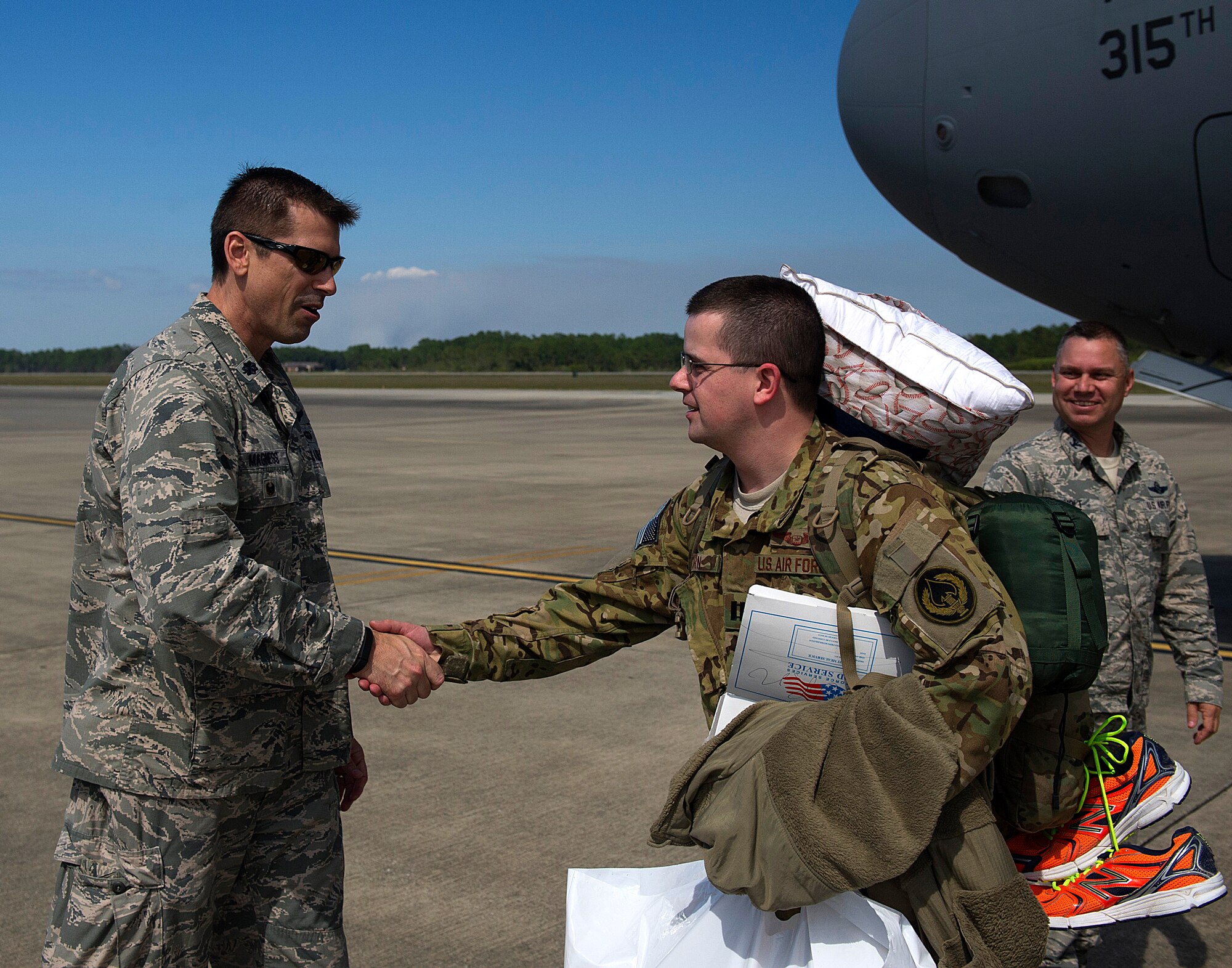 Members of the 9th Special Operations Squadron and 15th Special Operations Squadron return from deployment on Hurlburt Field, Fla., April 21, 2014. The Airmen landed on the flightline aboard a C-17 Globemaster III. (U.S. Air Force photo/Airman 1st Class Jeff Parkinson)