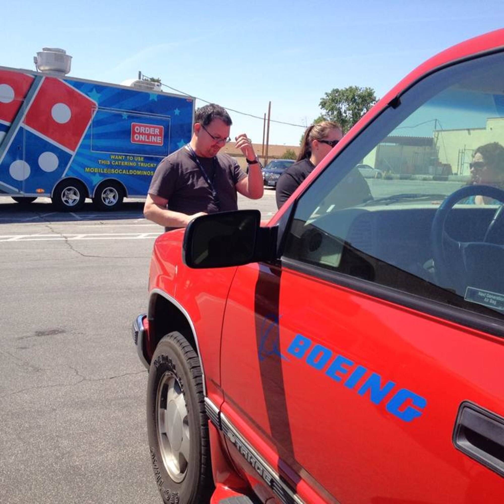 The mobile Domino's Pizza took their first order for five pizzas on the hood of one of Boeing's truck for Boeing's Earth Day celebration. In celebration of their first order, Domino's gave the five-pizza order for free. (Courtesy photo)

