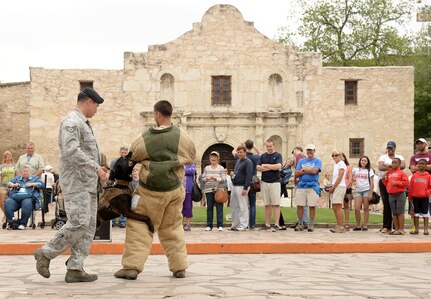 Air Force Military Working Dogs and their handlers demonstrate the unique capabilities and vital mission of military working dogs April 21 during the San Antonio Fiesta 2014’s Air Force Day at the Alamo. (U.S. Air Force photo by Ben Faske)