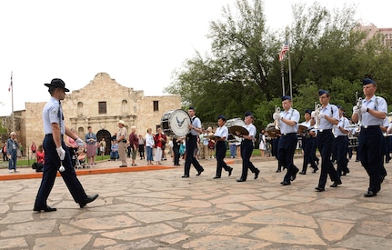 Joint Base San Antonio-Lackland Drum and Bugle Corps, comprised of JBSA-Lackland basic military trainees who have been in the Air Force less than eight weeks, perform at the San Antonio Fiesta 2014 April 21 during Air Force Day at the Alamo.   From its beginning in 1891, Fiesta has grown into an annual celebration that includes civic and military observances, street and river float parades, exhibits, sports, music and food representing the spirit, diversity and vitality of San Antonio. (U.S. Air Force photo by Ben Faske)