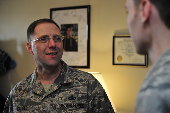 Chief Master Sgt. Stanley C.P. Cadell, 436th Airlift Wing command chief, talks to an Airman during a dorm room inspection April 11, 2014, at Dover Air Force Base, Del. Cadell spent nine years of his career as a first sergeant before becoming a command chief. (U.S. Air Force photo/Staff Sgt. Elizabeth Morris) 